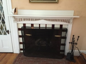 Another tiled fireplace, with the inscription, 